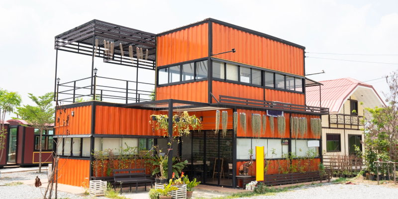 spacious-living-container-home Image of a modern metal building made from shipping house containers illustrates spacious living in shipping container homes.