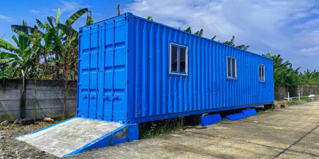 prefab-ablution-blocks A blue prefabricated container building, demonstrating modern, portable ablution block solution.